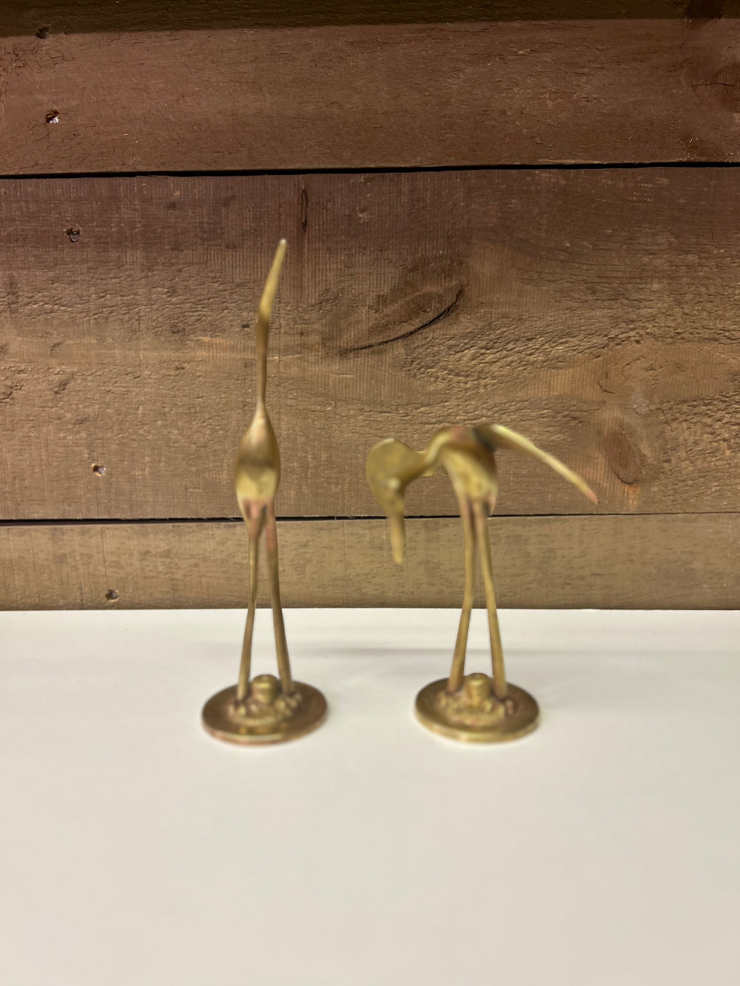 Set of two brass cranes