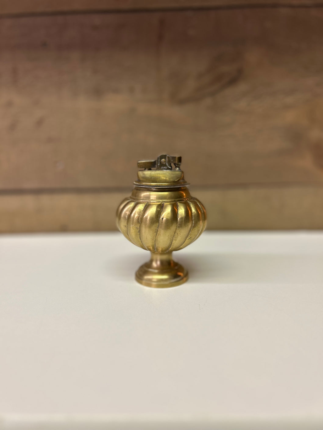 Vintage brass pedestal lighter
